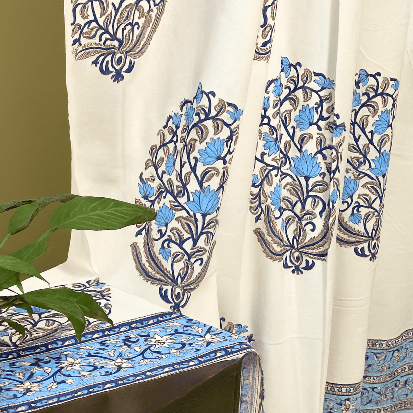 Handprinted curtain blue floral pattern with leafy green plant