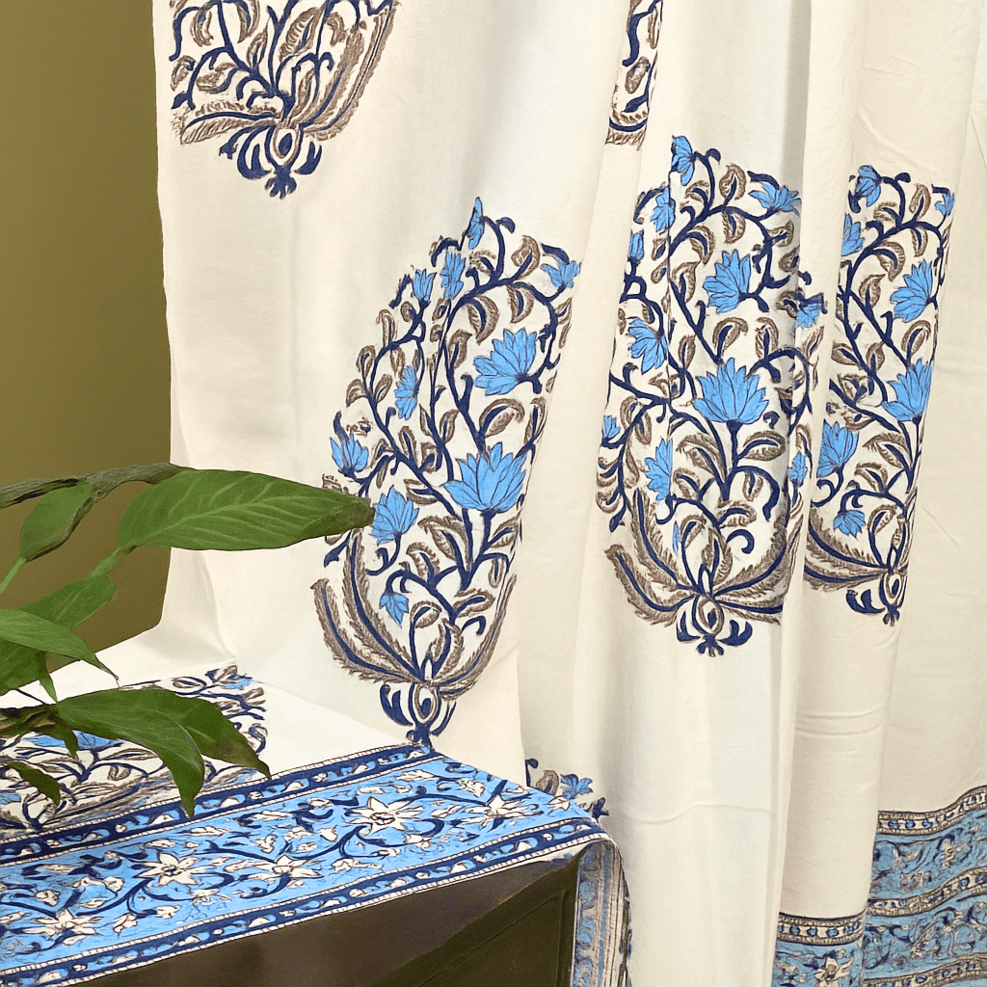Handprinted curtain blue floral pattern with leafy green plant