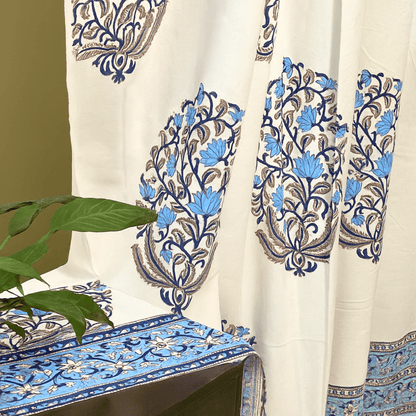 Handprinted curtain blue floral pattern with leafy green plant