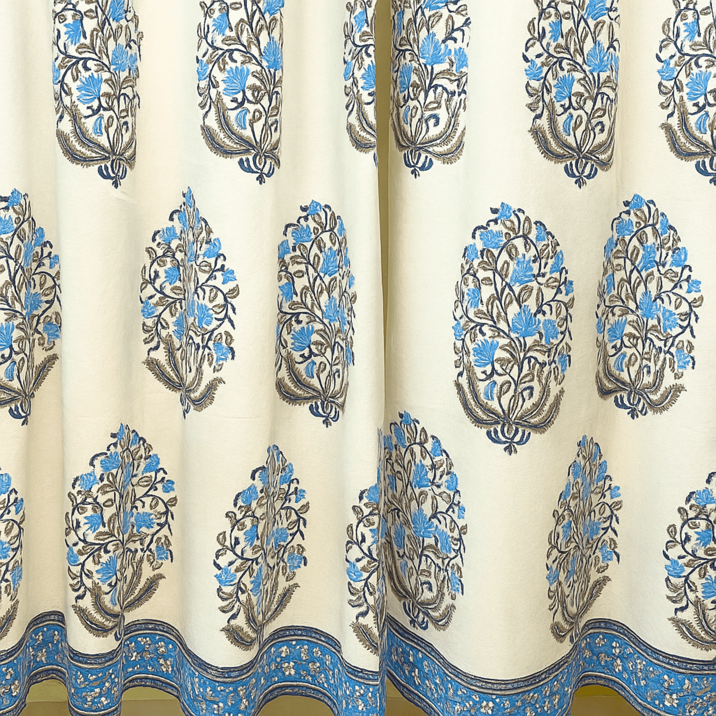 Mughal-inspired handblock printed curtain with blue border and lotus boota motifs