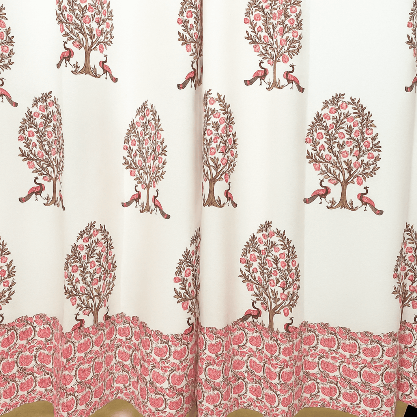 Handprinted cotton curtain with pink peacock tree motifs and dense pomegranate fruit border at the bottom
