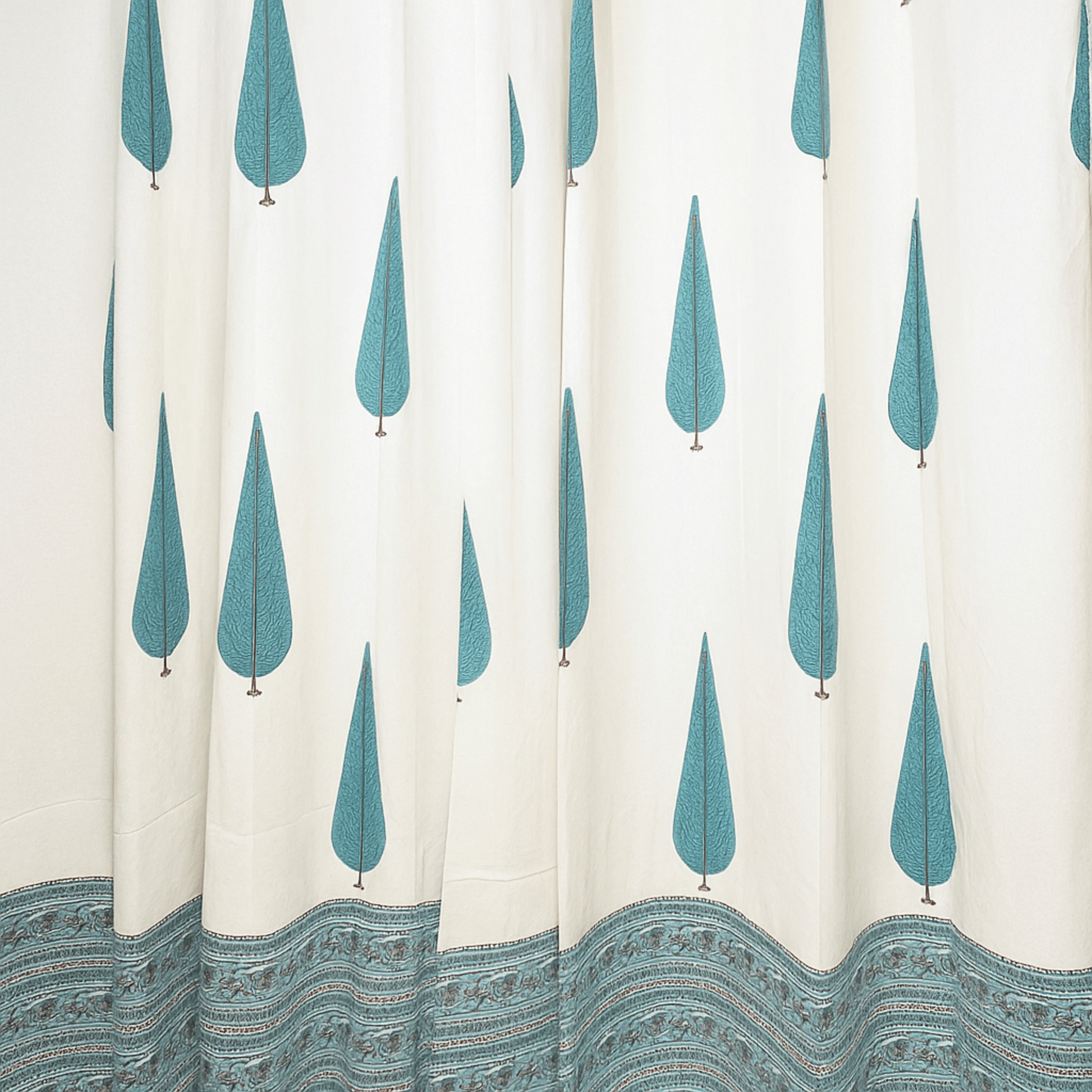 Cypress tree printed curtain with intricate blue paisley border design at the hem