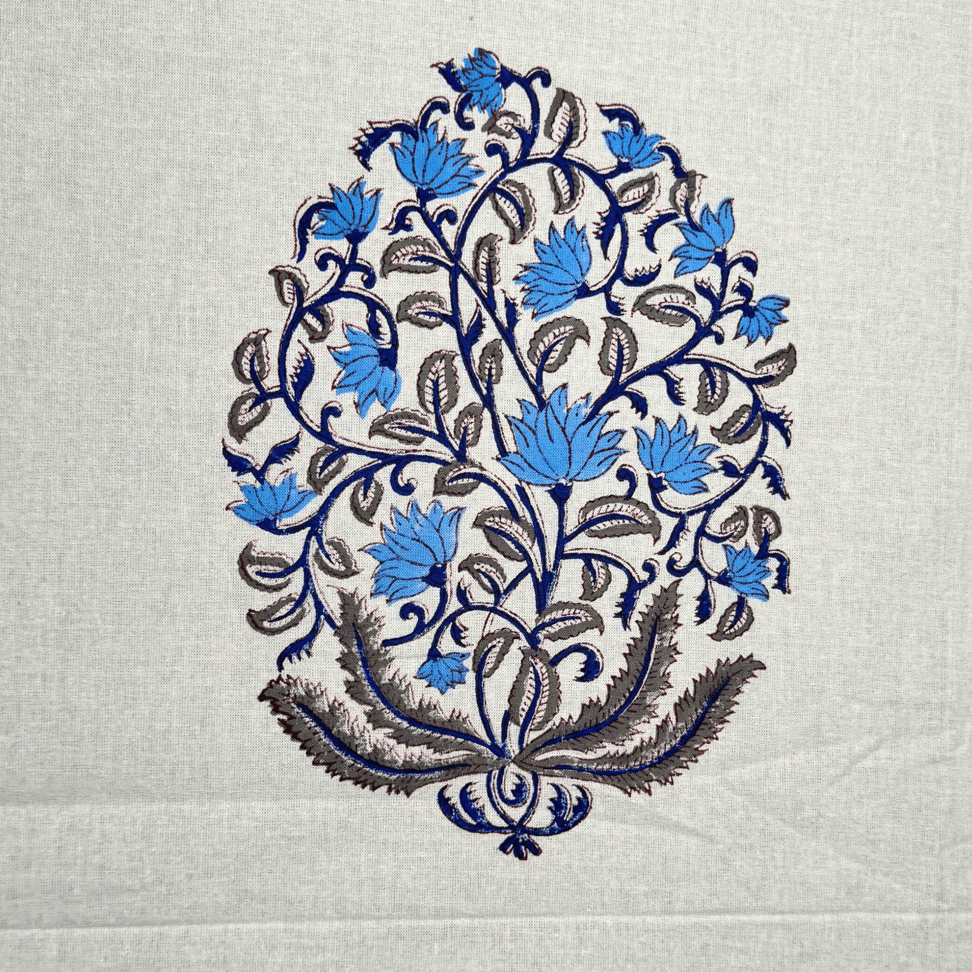 Detailed view of traditional blue Mughal boota handblock print on cotton fabric