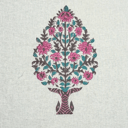 Close-up of traditional pink floral tree block print on white cotton fabric

