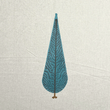 Close-up of handprinted blue cypress tree motif on off-white cotton curtain