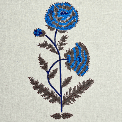 Detailed view of blue handblock printed flower on cotton curtain fabric